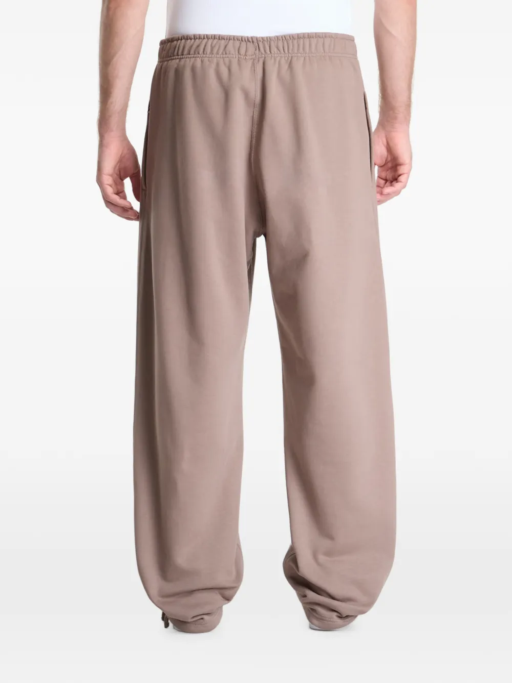 Nike Solo Swoosh track pants Beige