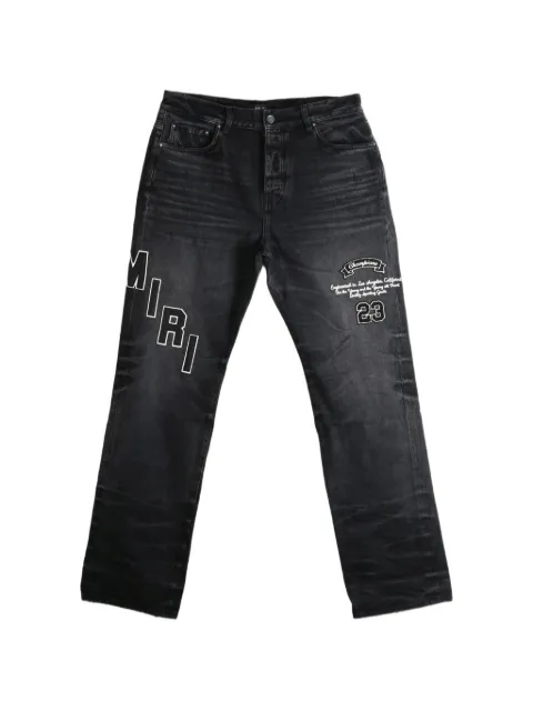 AMIRI logo-embroidered faded jeans