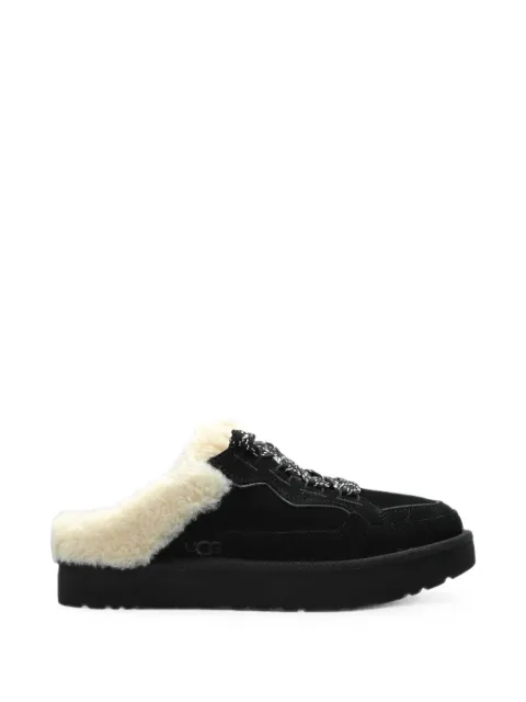 UGG slippers Lowmel con ribete de piel de borrego