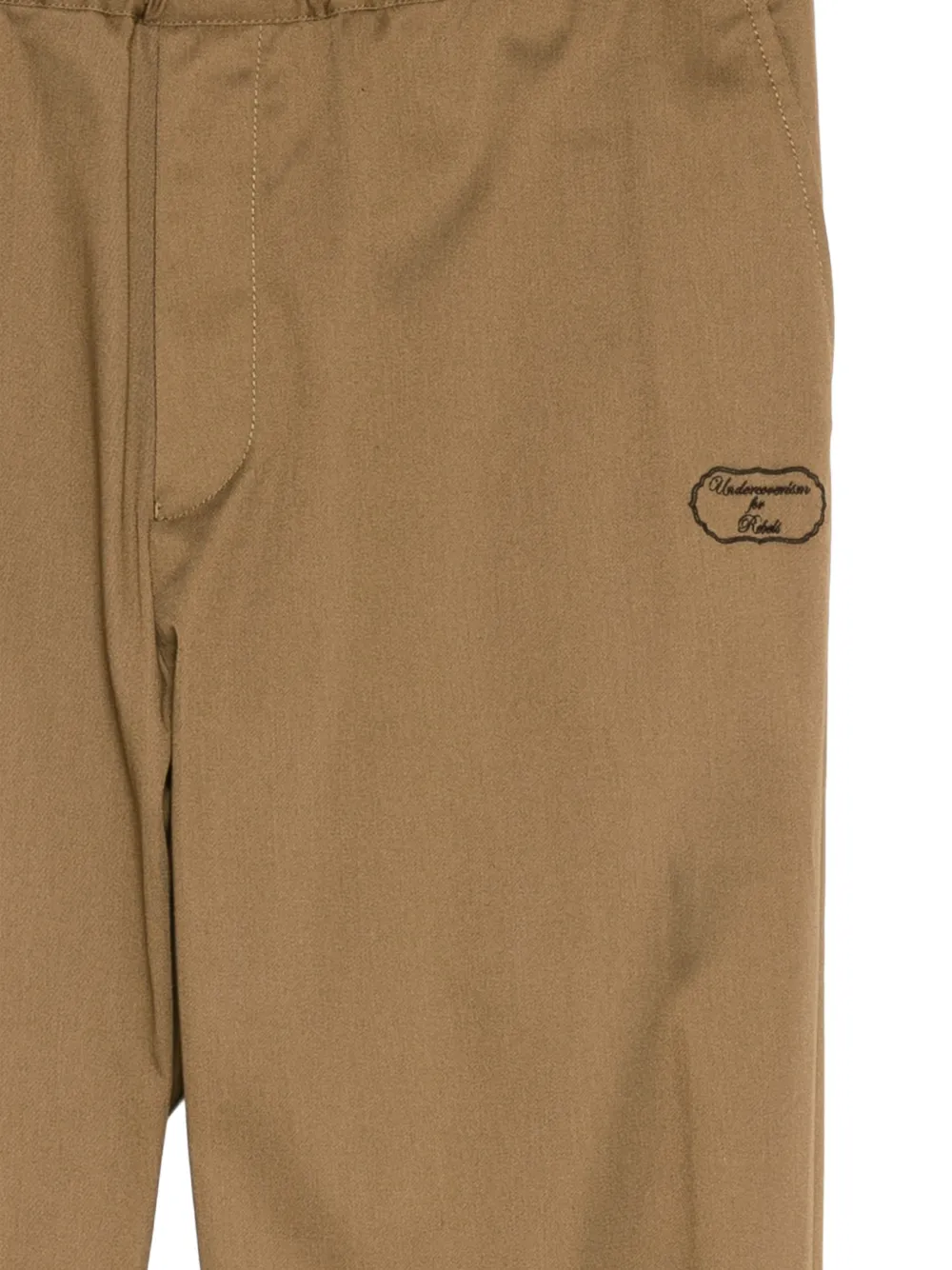 Undercover logo-embroideried track pants Beige