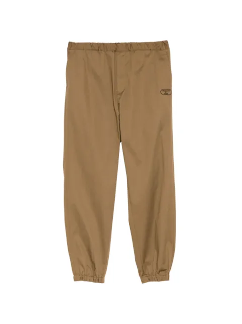 Undercover logo-embroideried track pants