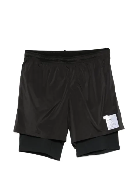 Satisfy layered logo-print shorts