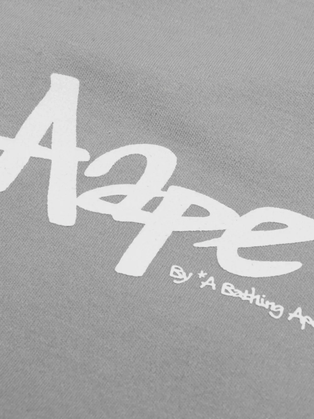 AAPE BY *A BATHING APE T-shirt met Moonface-print en lange mouwen Zwart