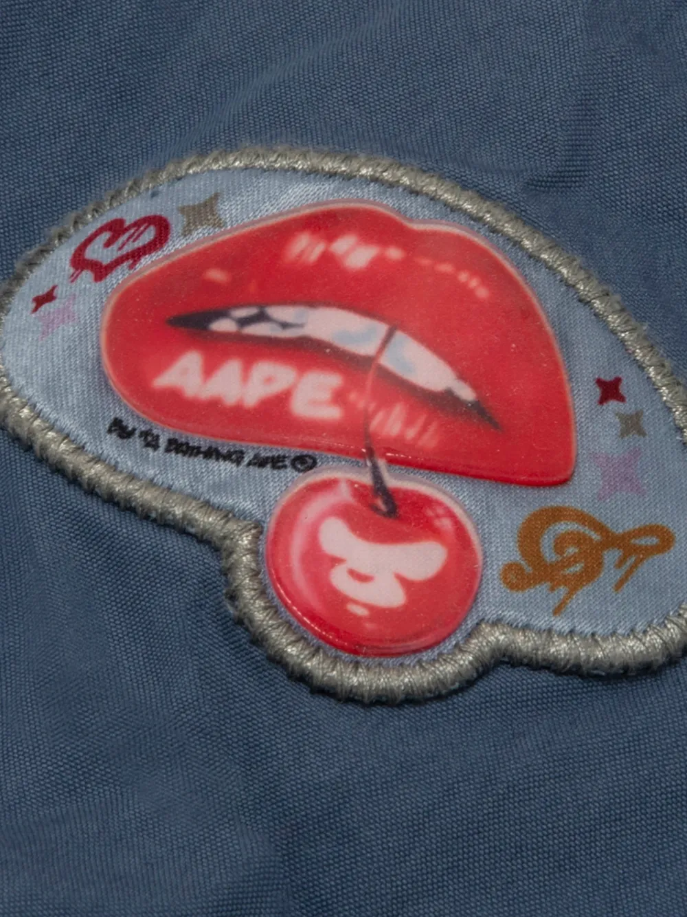 AAPE BY *A BATHING APE Cargo broek met patchdetail en afritsbare pijpen Blauw