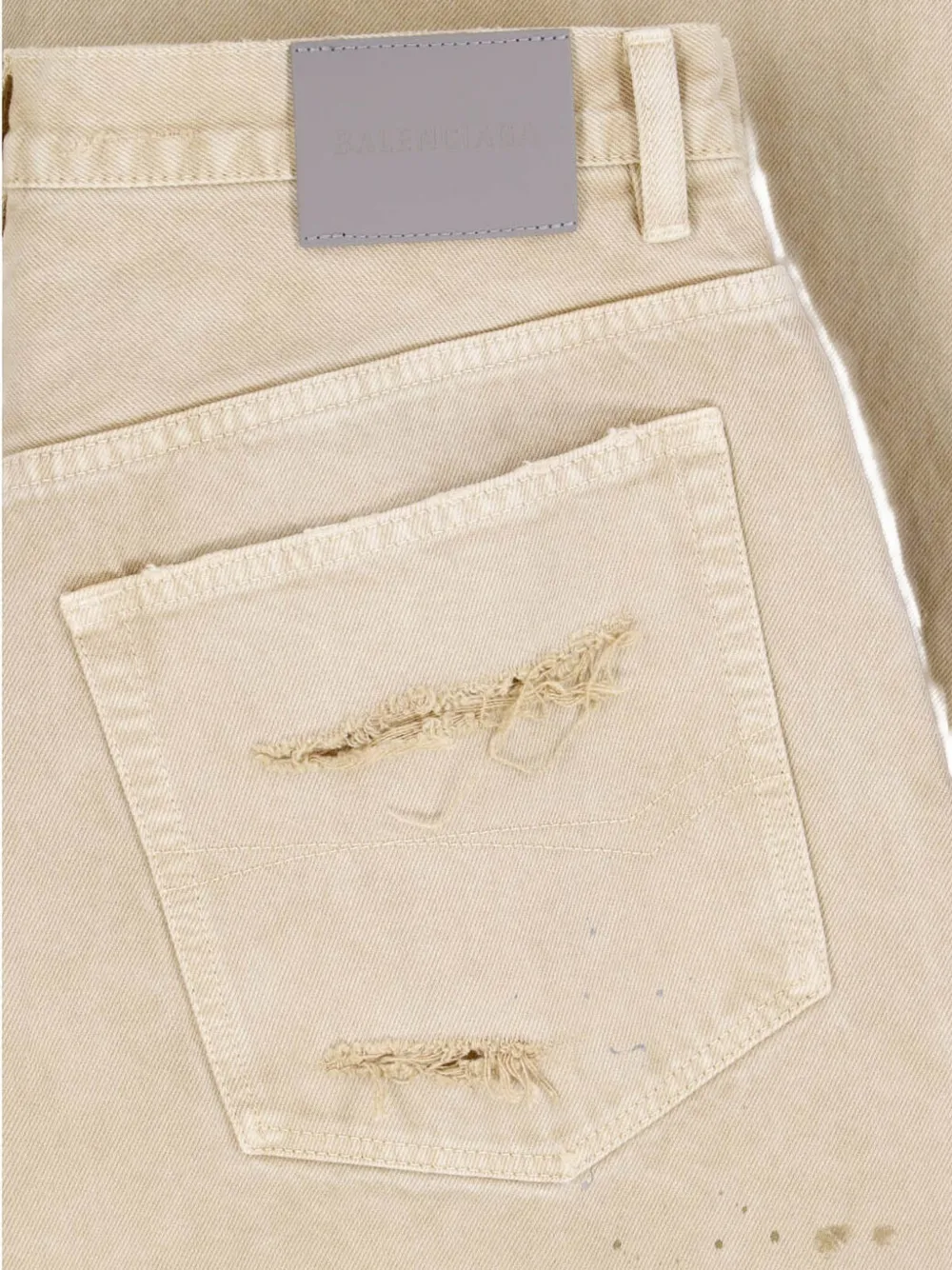 Balenciaga Gerafelde jeans met wijde pijpen en verfspatten print Beige