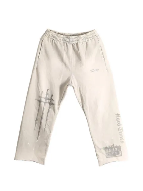 SAITOS Sword graphic-print raw-cut track pants