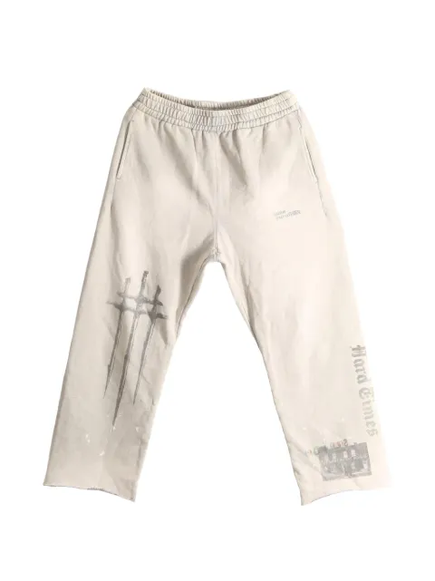 SAITOS Sword graphic-print raw-cut track pants