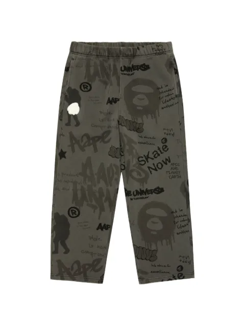 AAPE BY *A BATHING APE® AAPEUNVS graffiti-print track pants