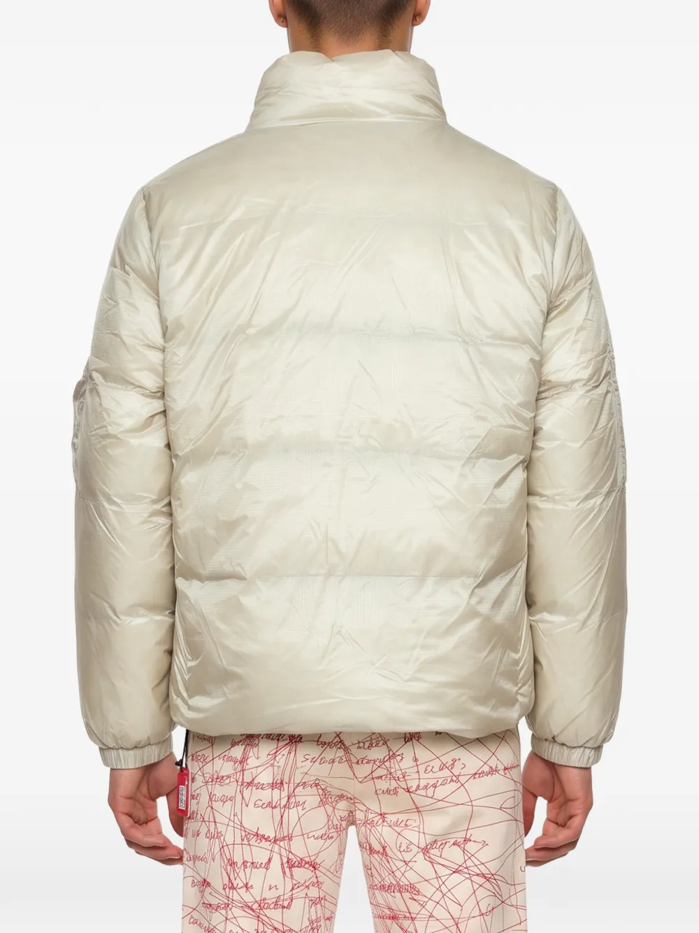 KidSuper Gewatteerd jack met gezichts-print Beige