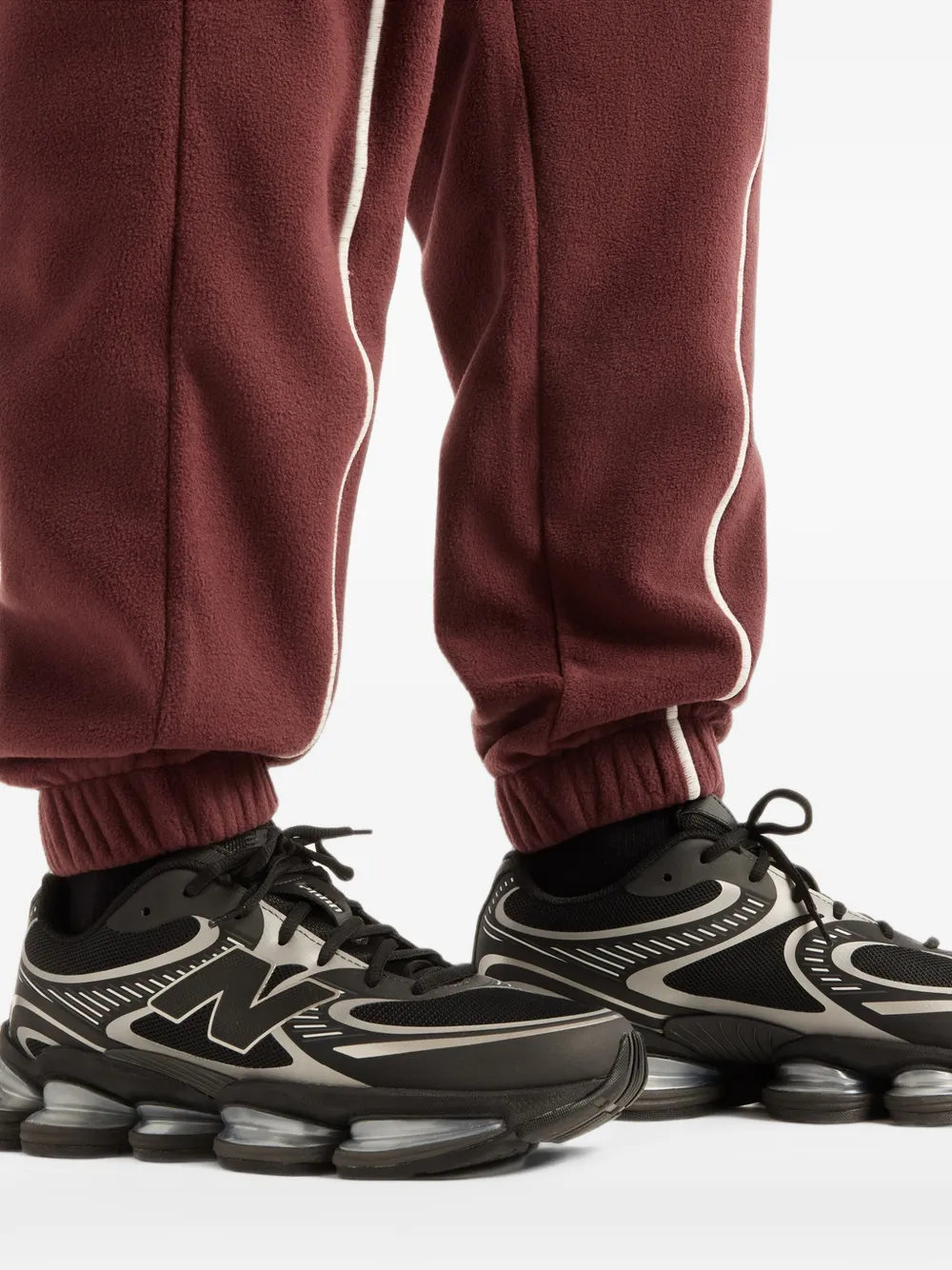 New Balance Trackside Polar Fleece track pants Rood
