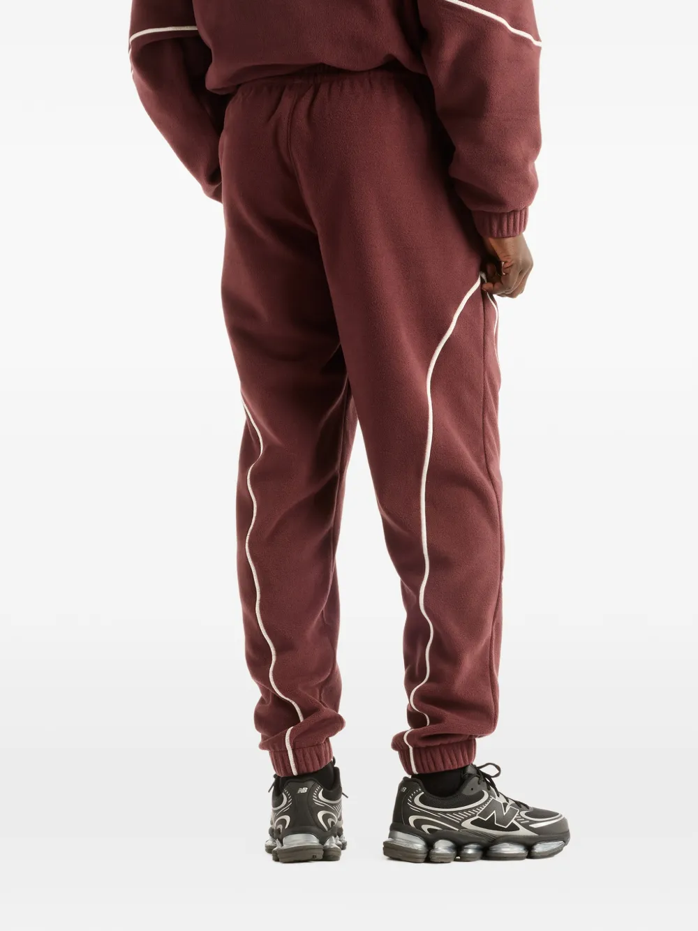 New Balance Trackside Polar Fleece track pants Rood
