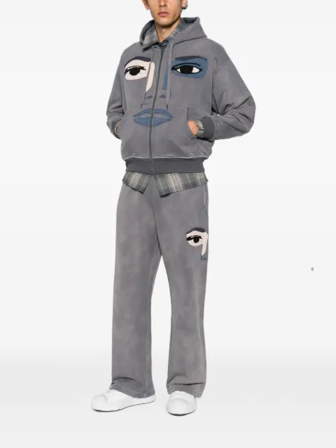 KidSuper face-patch track pants