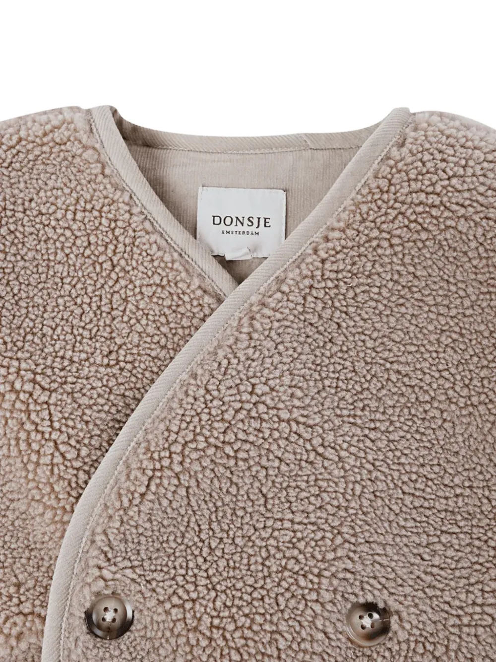 Donsje Monty bodywarmer met dubbele rij knopen en imitatielamswol Beige