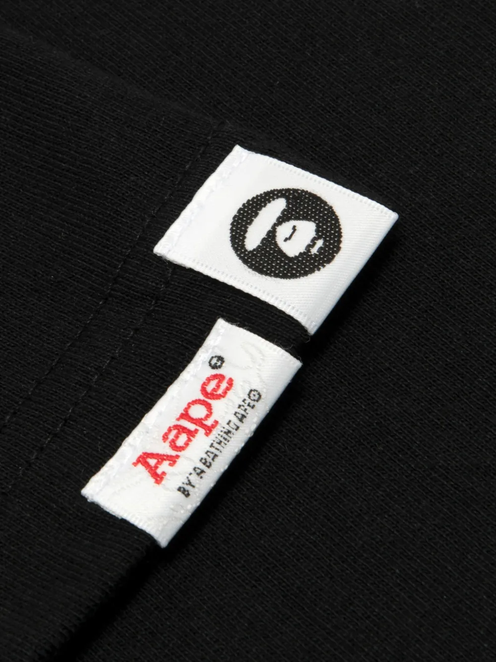 AAPE BY *A BATHING APE AAPEUNVS Moonface T-shirt met grafische print en logo-patch Zwart