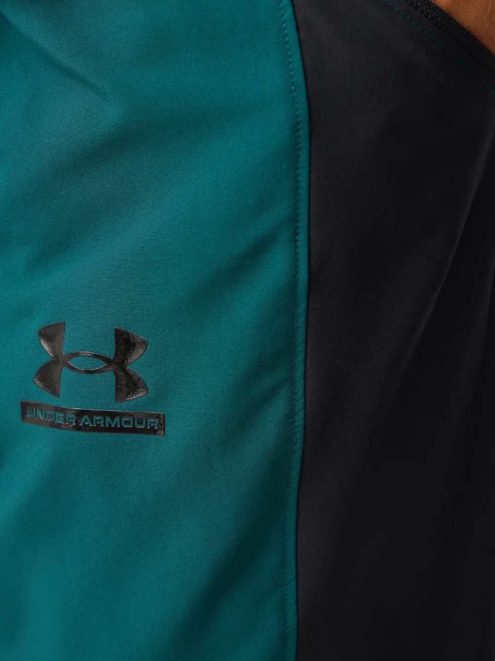 Under Armour Tech TM Sport elastische trainingsbroek met logo-print Groen
