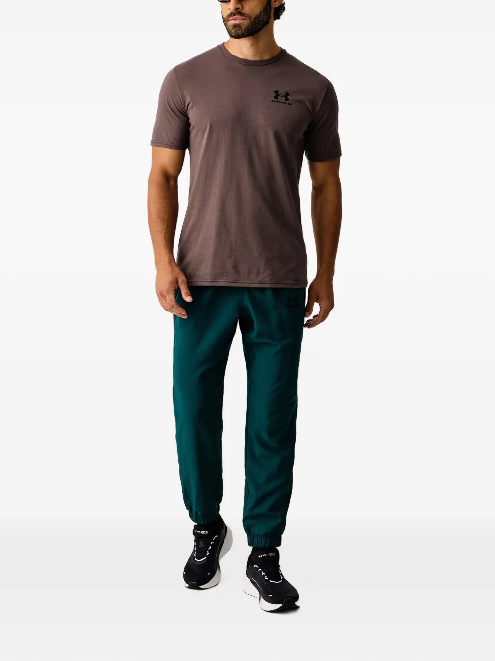 Under Armour Tech TM Sport elastische trainingsbroek met logo-print Groen