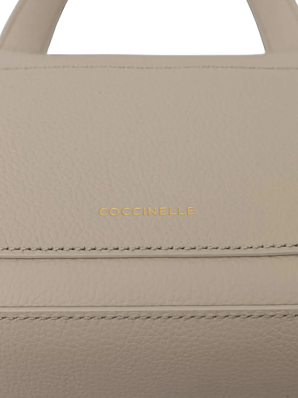 Coccinelle Kleine Nikla schoudertas van bewerkt leer Beige