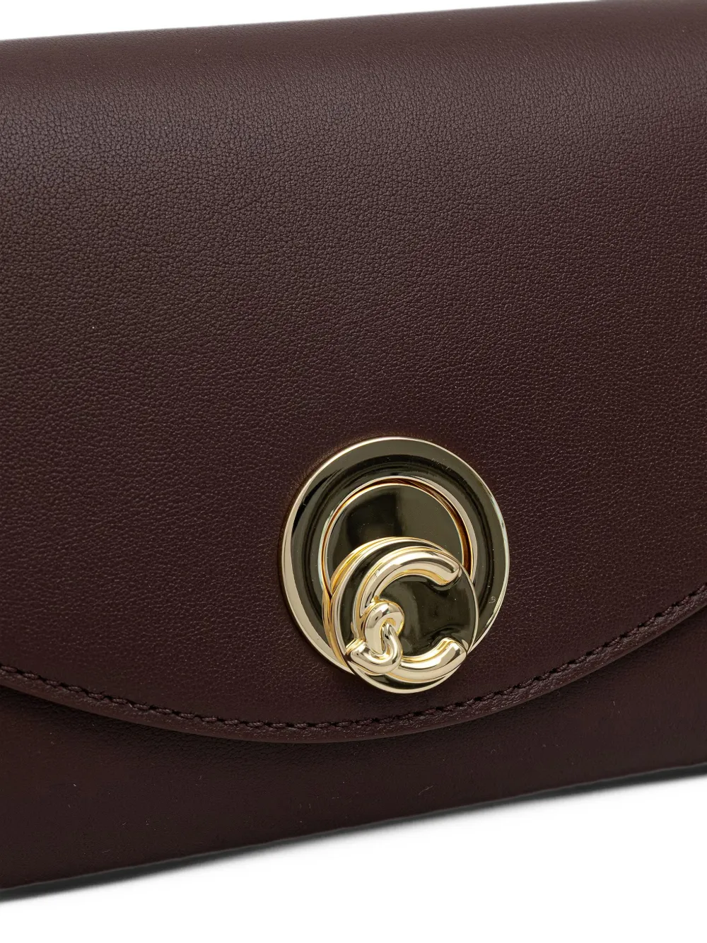 Coccinelle Kleine Nikla leren crossbodytas met logo-plakkaat Rood