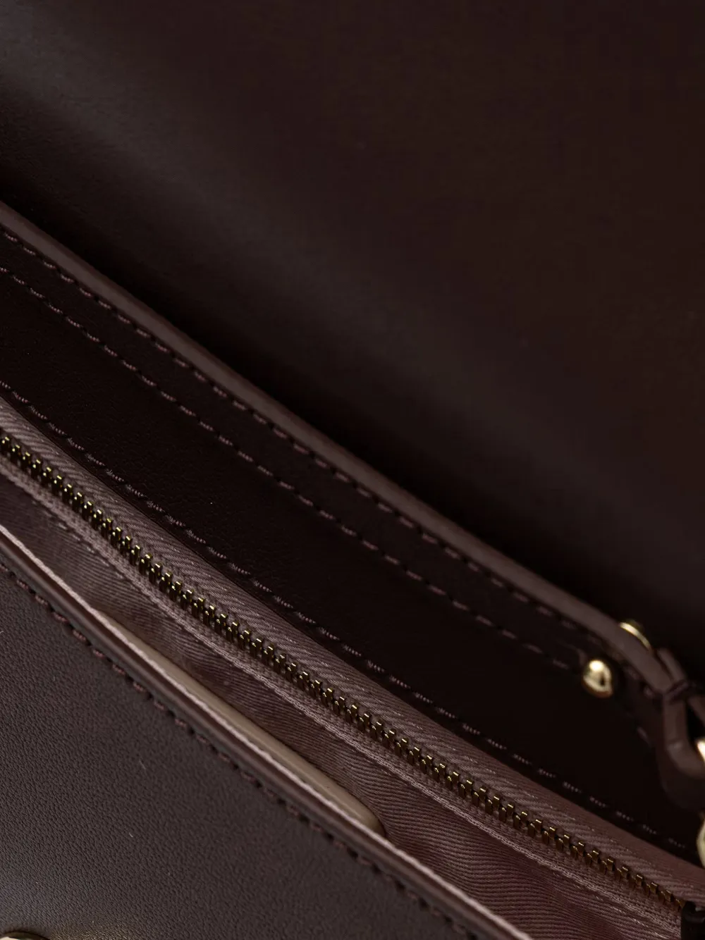 Coccinelle Kleine Nikla leren crossbodytas met logo-plakkaat Rood