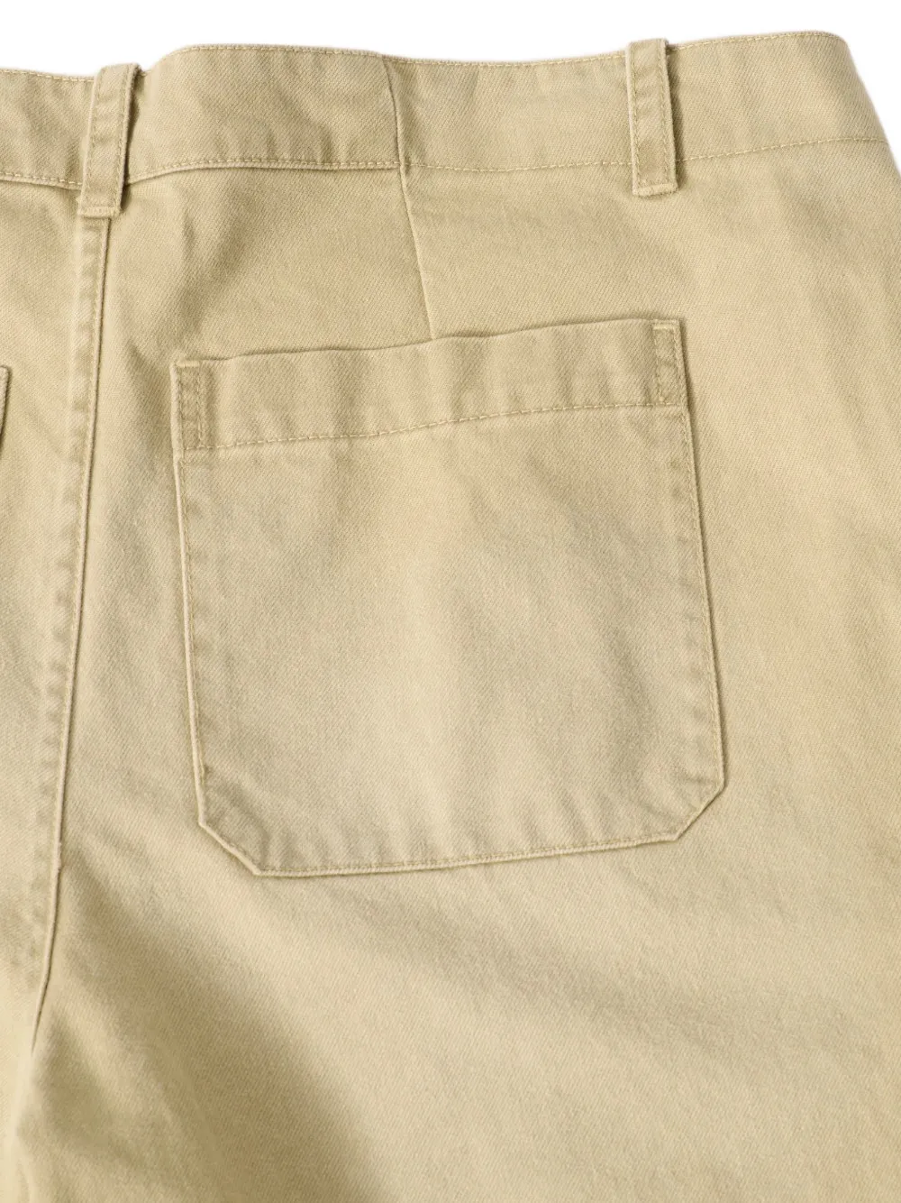 OUR LEGACY Still geplooide chino met pigmentwassing Beige
