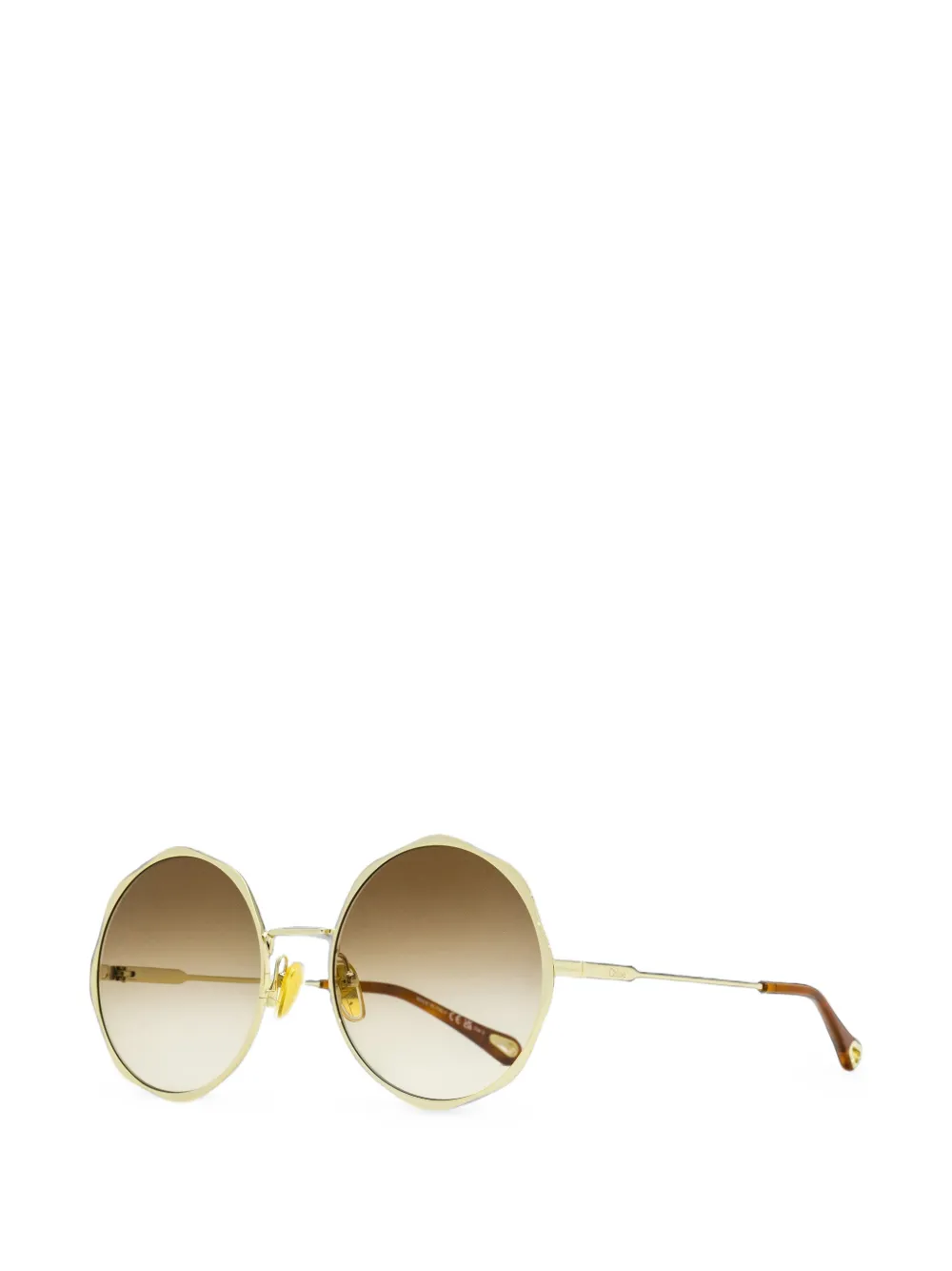 Chloé Eyewear Zonnebril met golvend rond montuur Goud