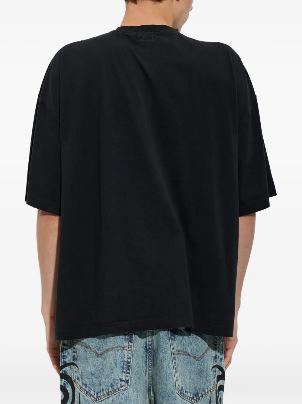 VETEMENTS slogan-print cotton T-shirt Zwart