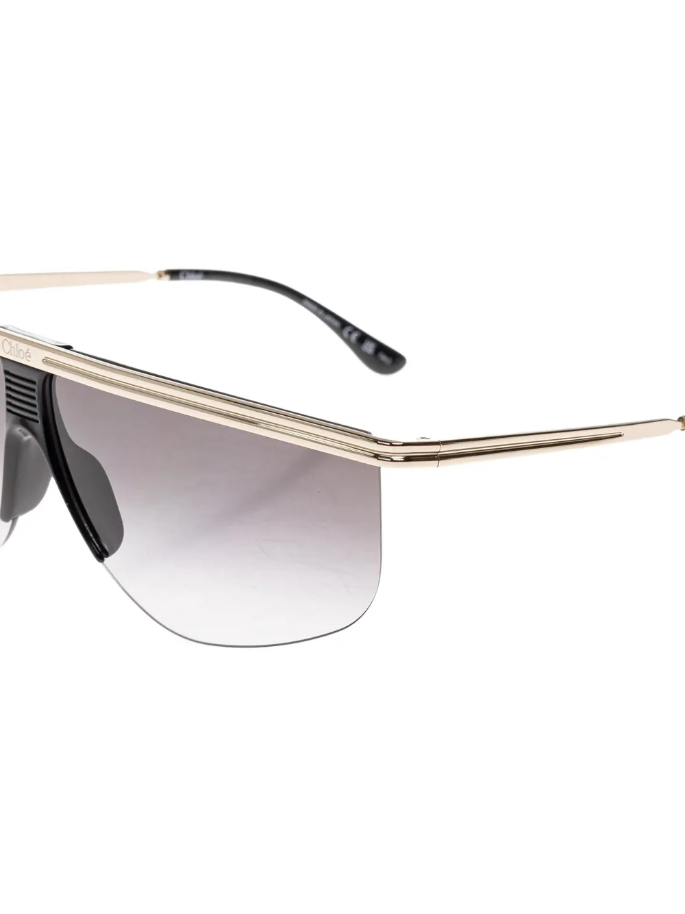 Chloé Eyewear Active zonnebril met randloos geometrisch montuur Goud