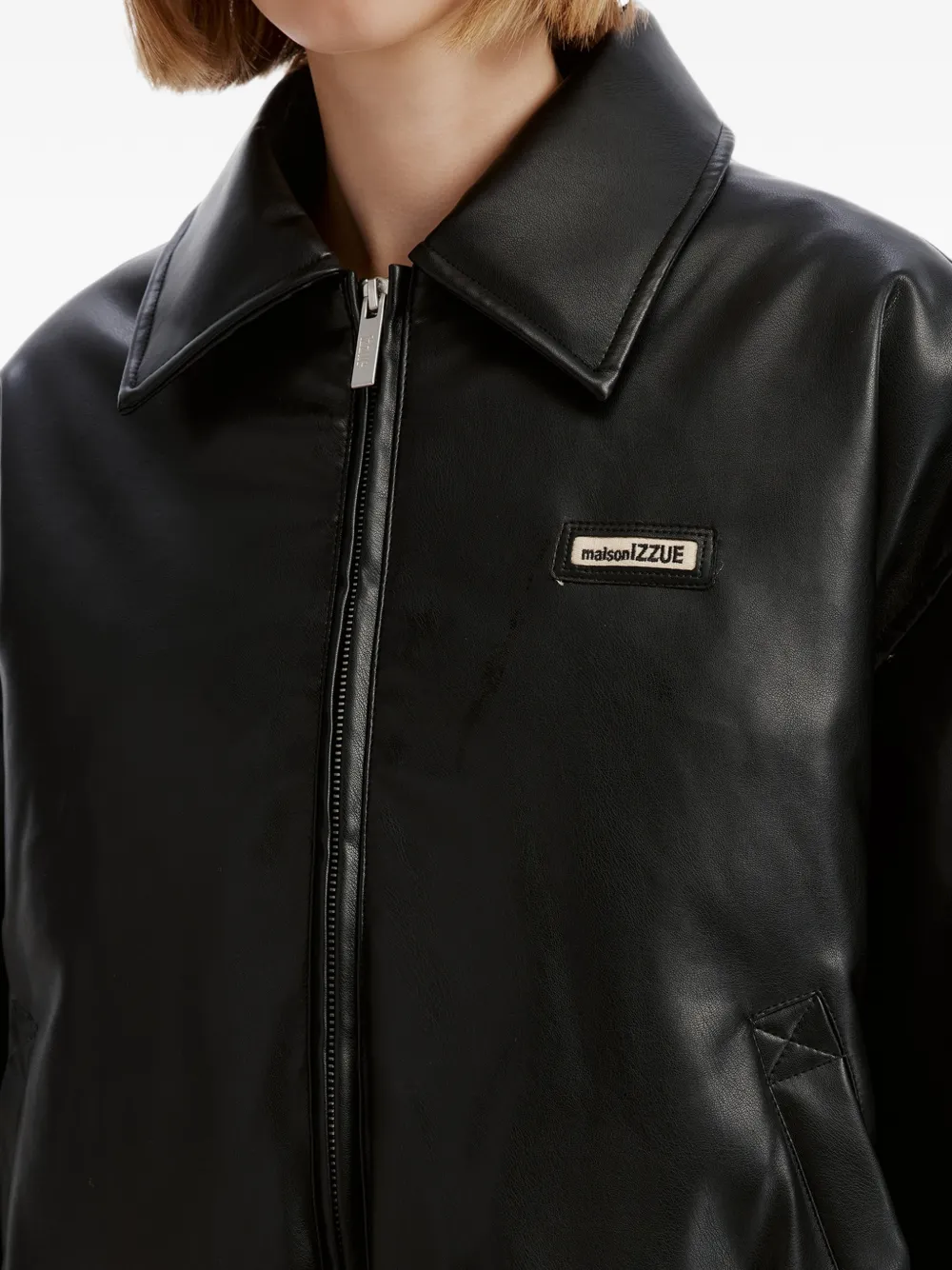 izzue logo-patch zip-up jacket Zwart