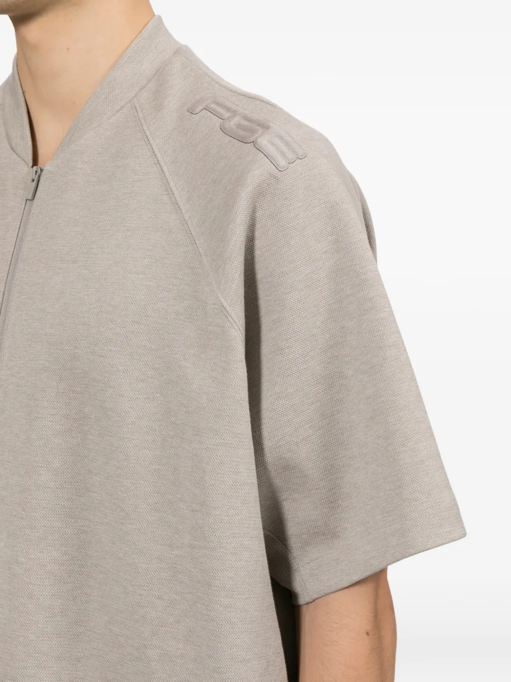 FEAR OF GOD ESSENTIALS T-shirt met halve rits en raglanmouwen Beige