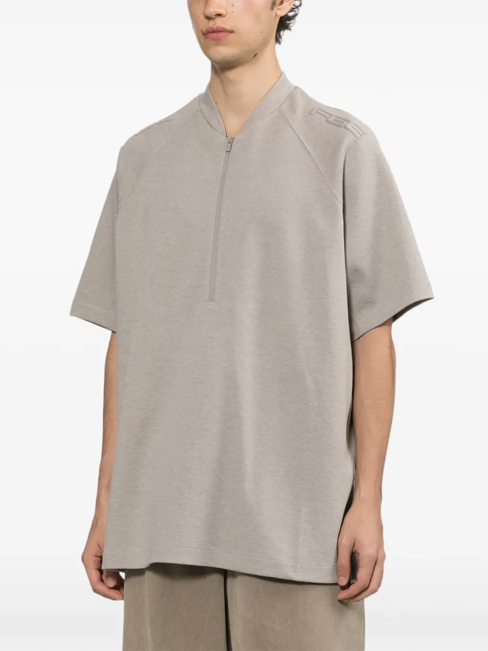 FEAR OF GOD ESSENTIALS T-shirt met halve rits en raglanmouwen Beige