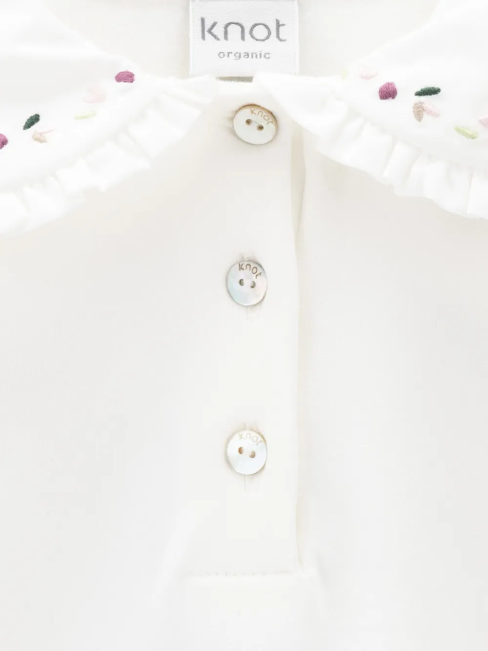 Knot Mila poloshirt met borduurwerk en ruches Wit