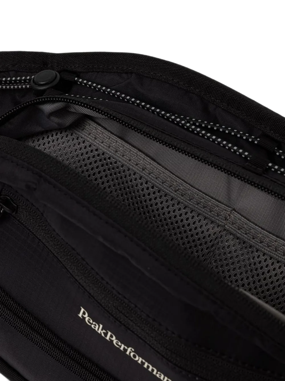 Peak Performance Trail heuptas met rits en logo-print Zwart