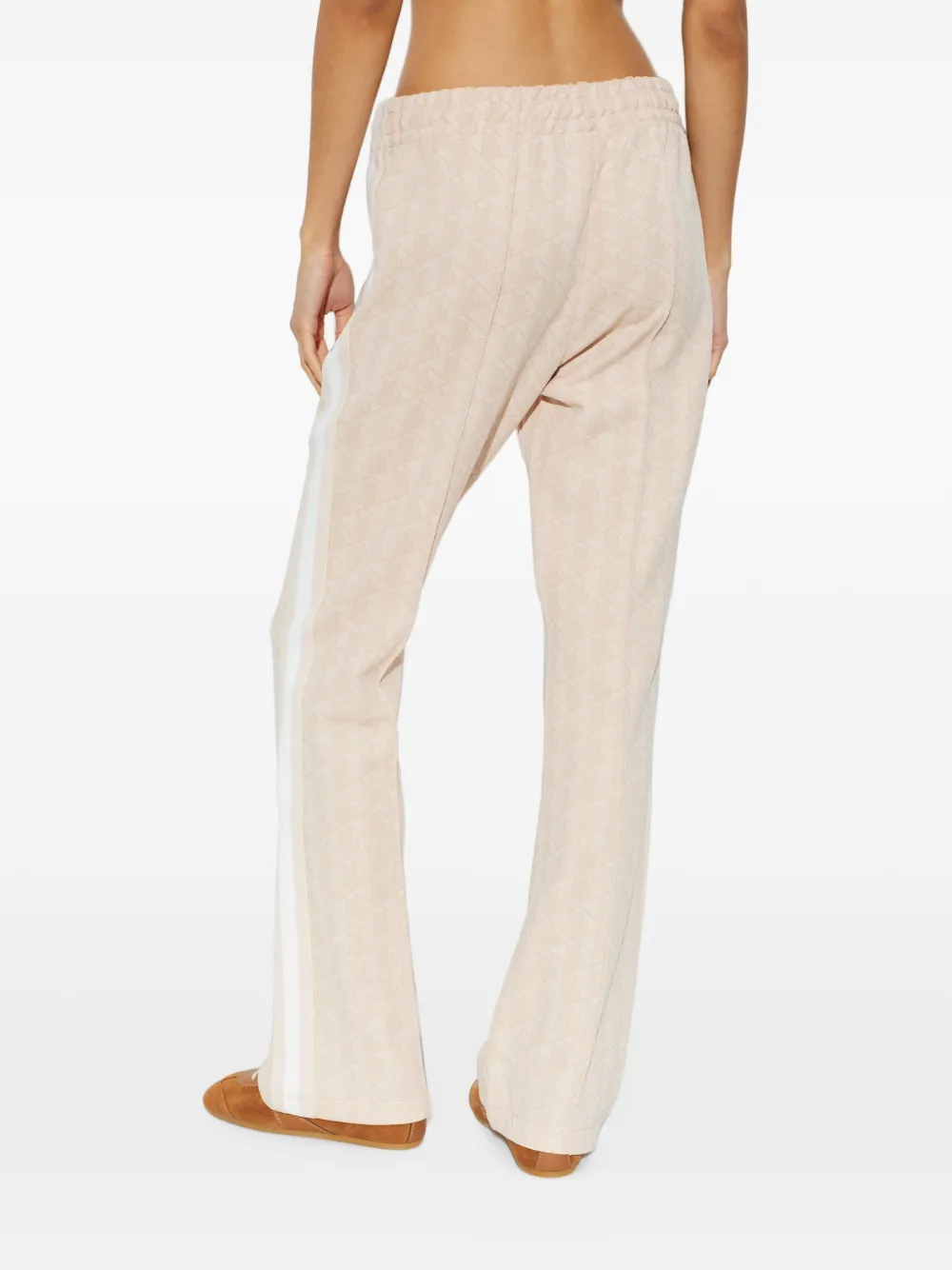 Lacoste Flared trainingsbroek met monogram-patroon Roze
