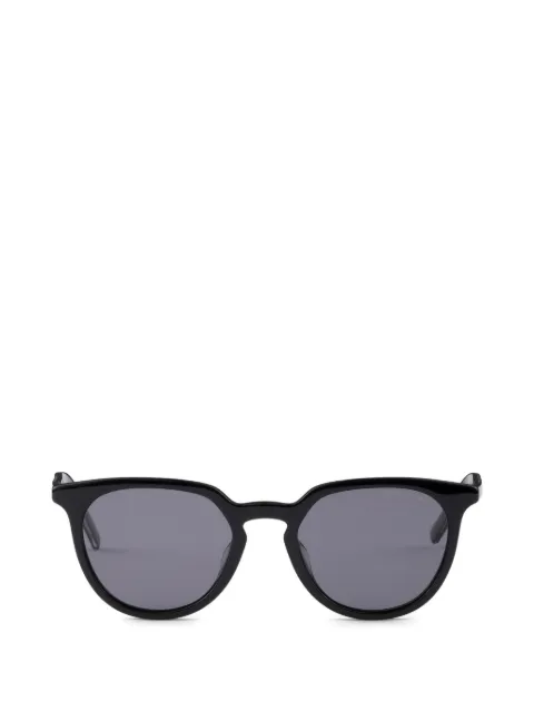 Prada sunglasses with the iconic metal plaque