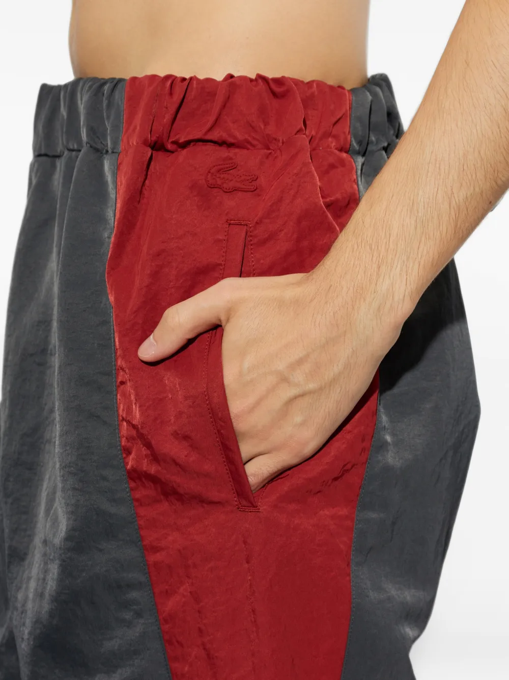 Lacoste Runway ruimvallende joggingbroek met streepdetail Grijs
