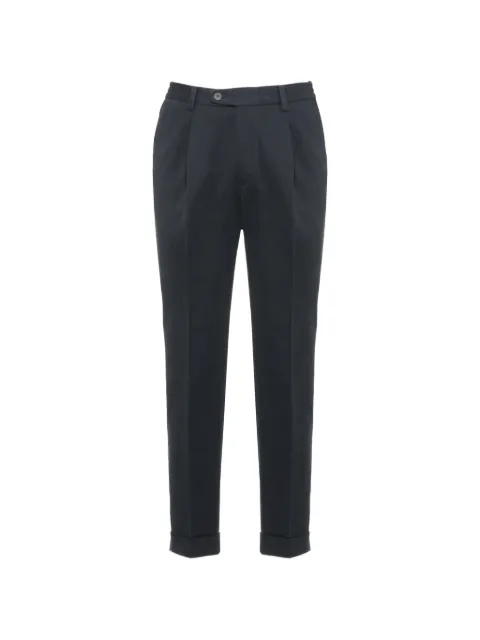 DEVORE pleated turned-up-cuff trousers