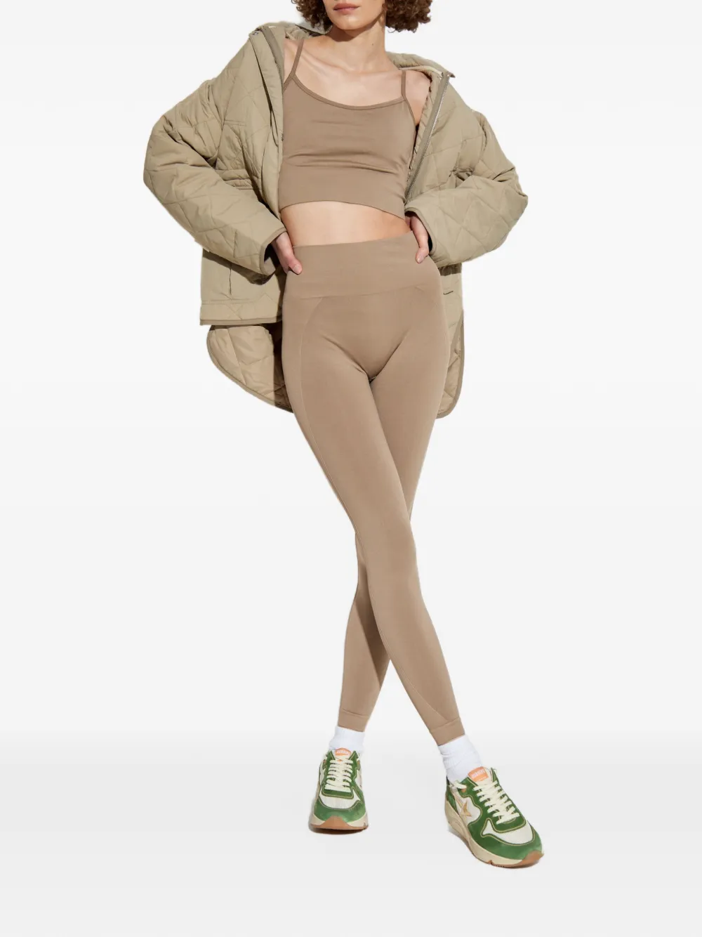 RETHINKIT STUDIOS Naadloze performance top met gekruiste bandjes Beige