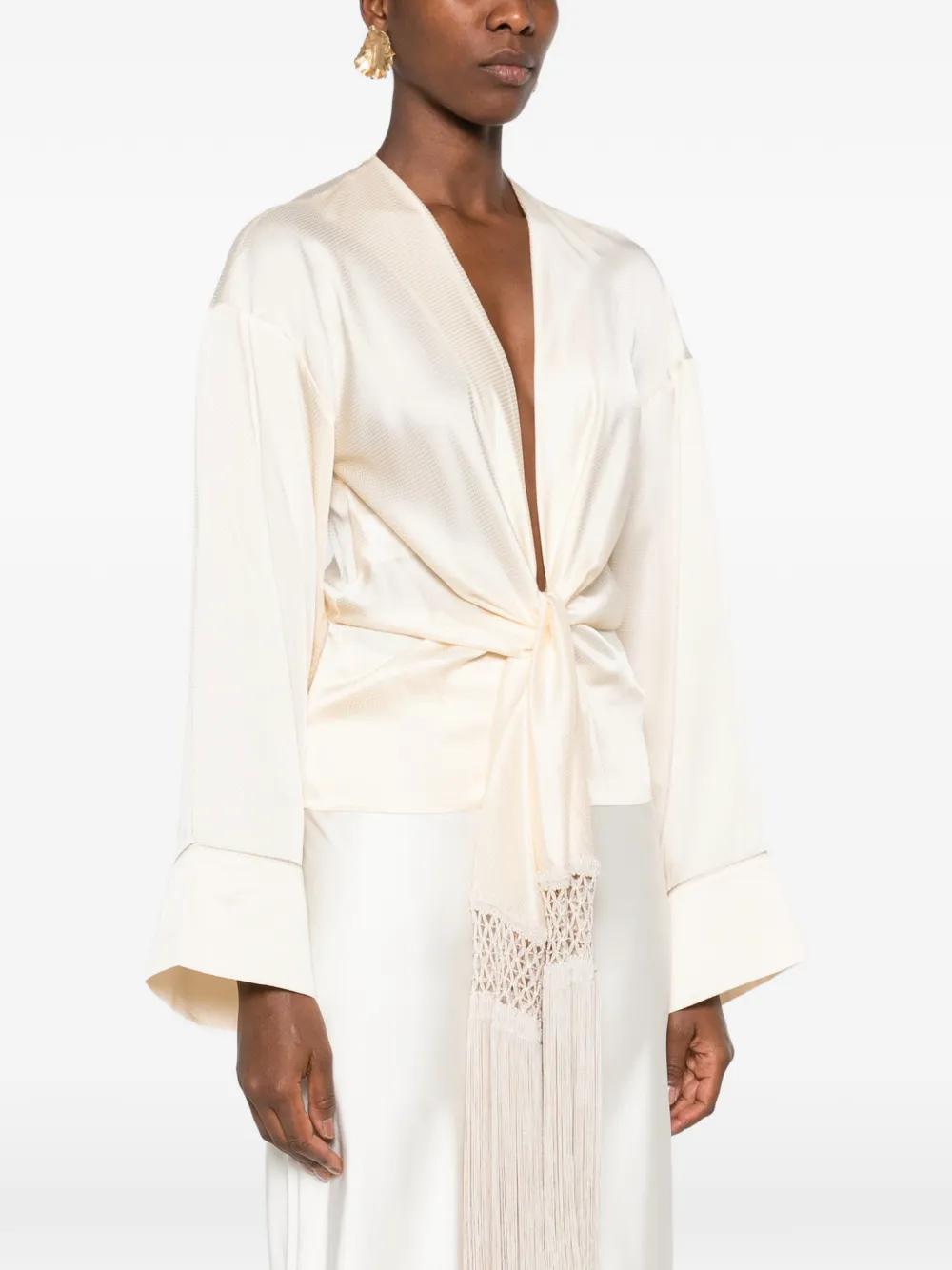 THE ANDAMANE fringe-trim tie-front blouse Beige