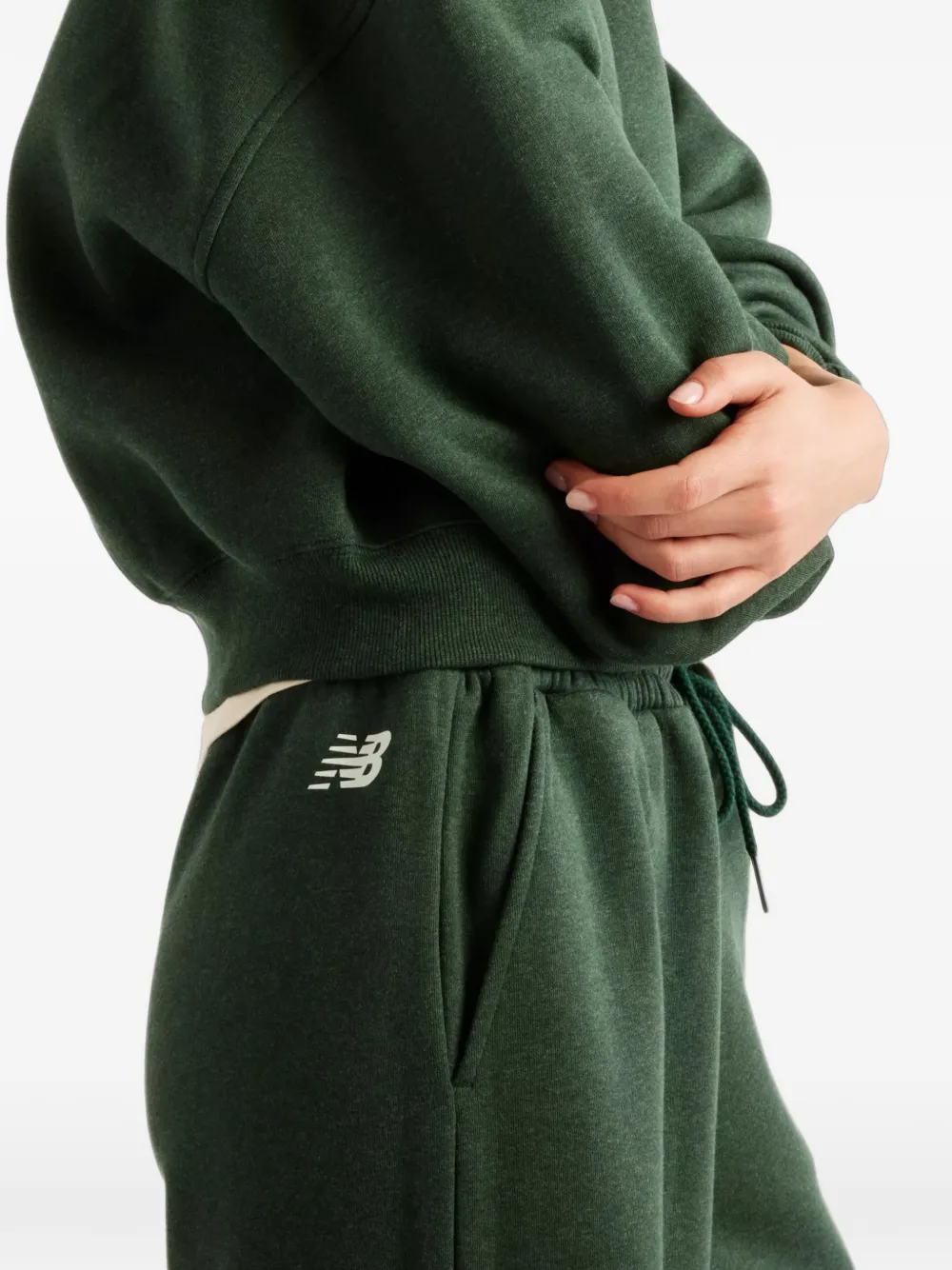 New Balance Trackside fleece pants Groen