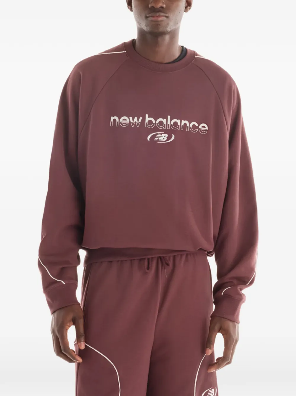 New Balance Trackside French terry crew Rood
