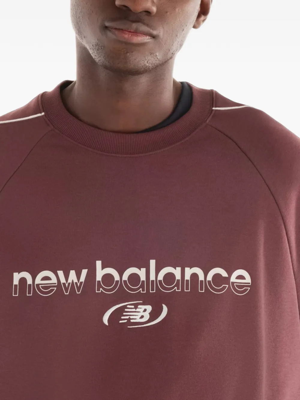 New Balance Trackside French terry crew Rood