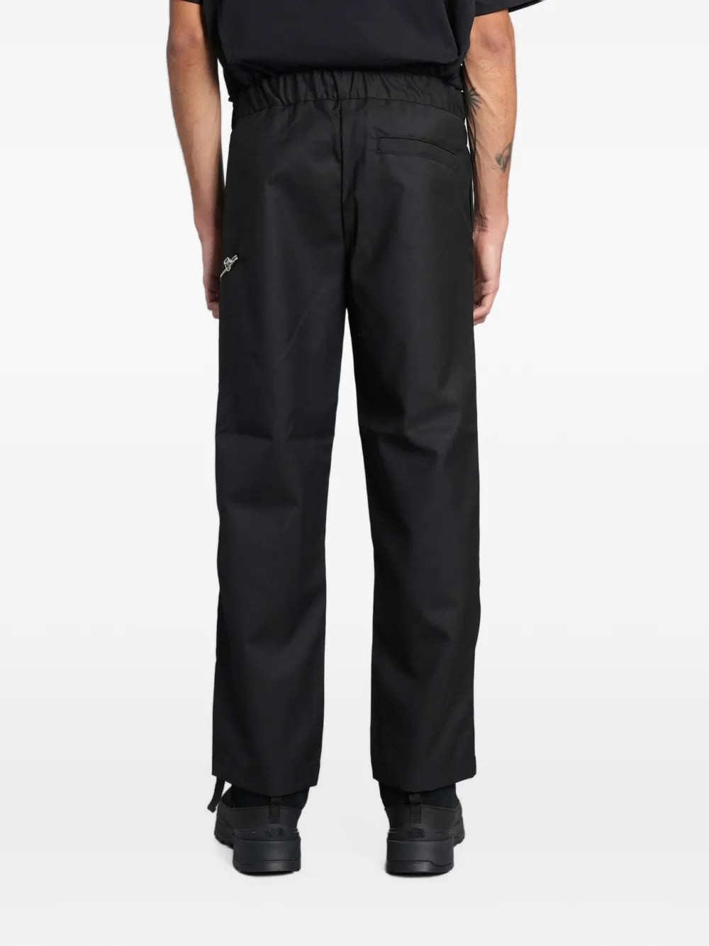 Peacemaker Oamc belted zip-detail trousers Zwart