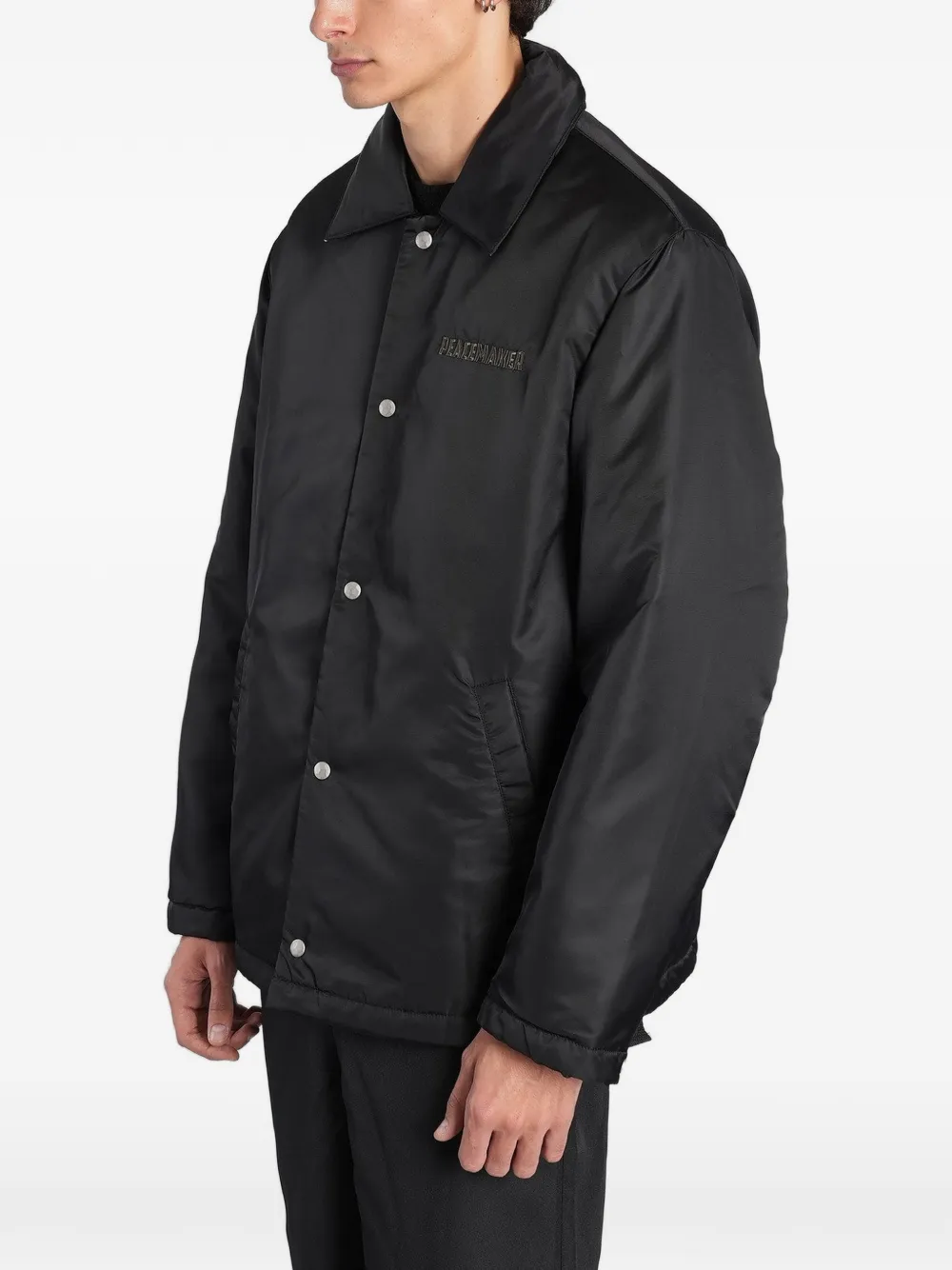 Peacemaker Oamc logo-embroidered padded jacket Zwart