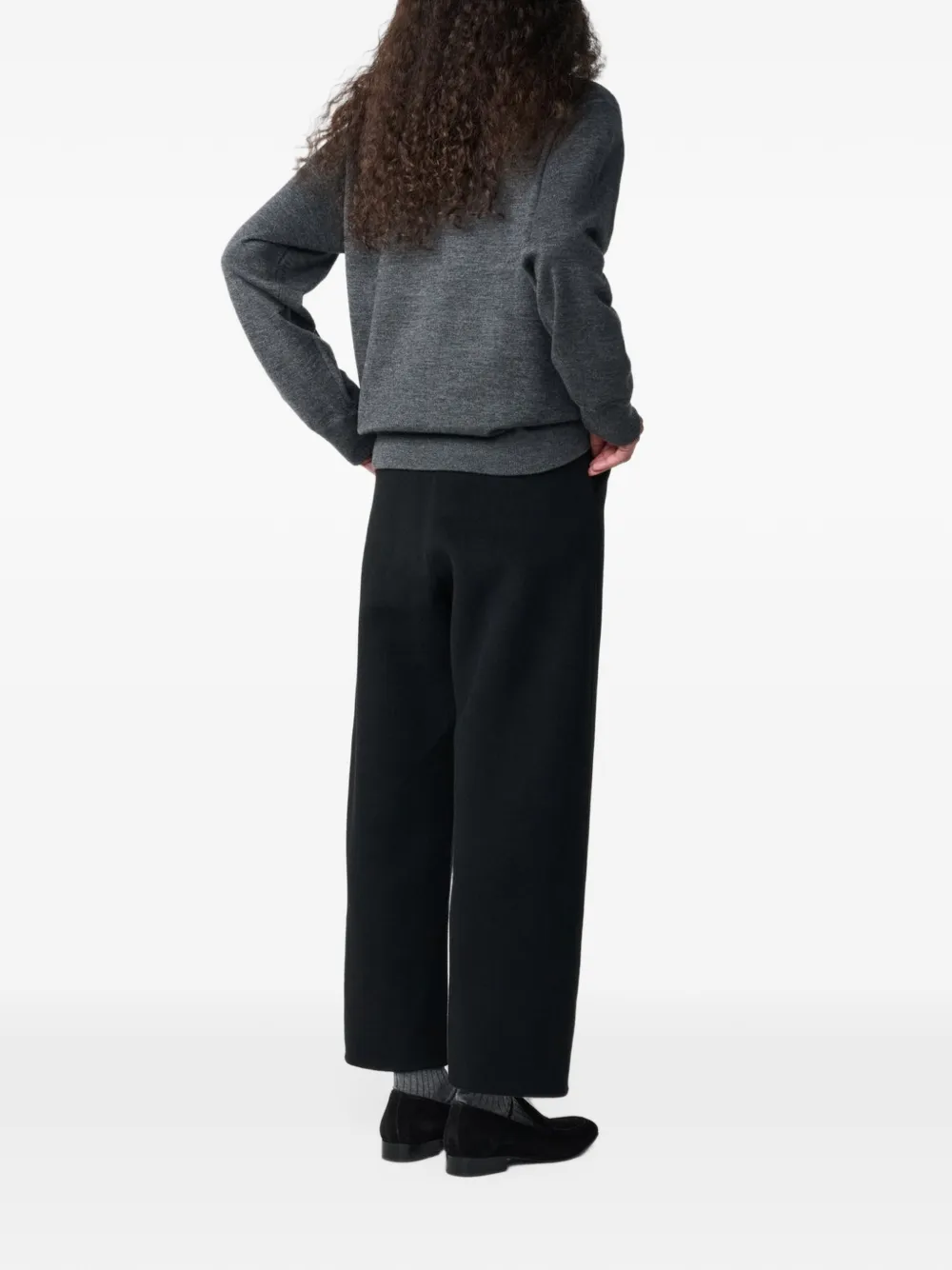 Studio Nicholson Myrtle curved-leg wool trousers Zwart