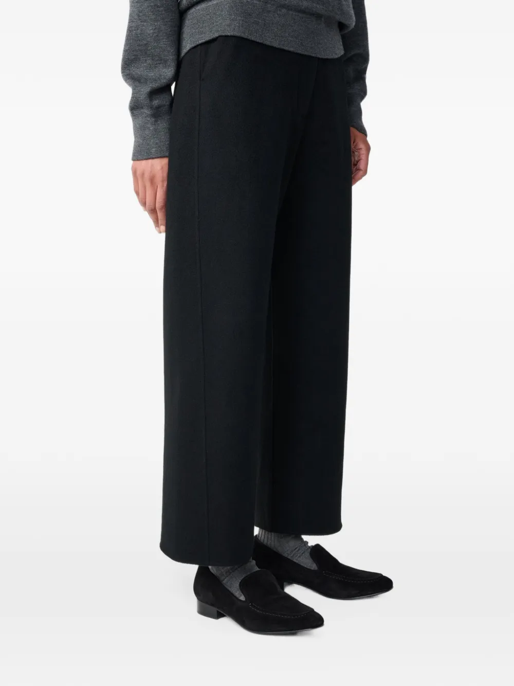 Studio Nicholson Myrtle curved-leg wool trousers Zwart