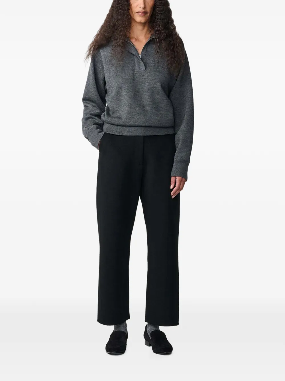 Studio Nicholson Myrtle curved-leg wool trousers Zwart