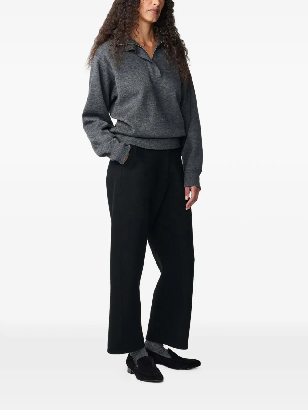 Studio Nicholson Myrtle curved-leg wool trousers Zwart
