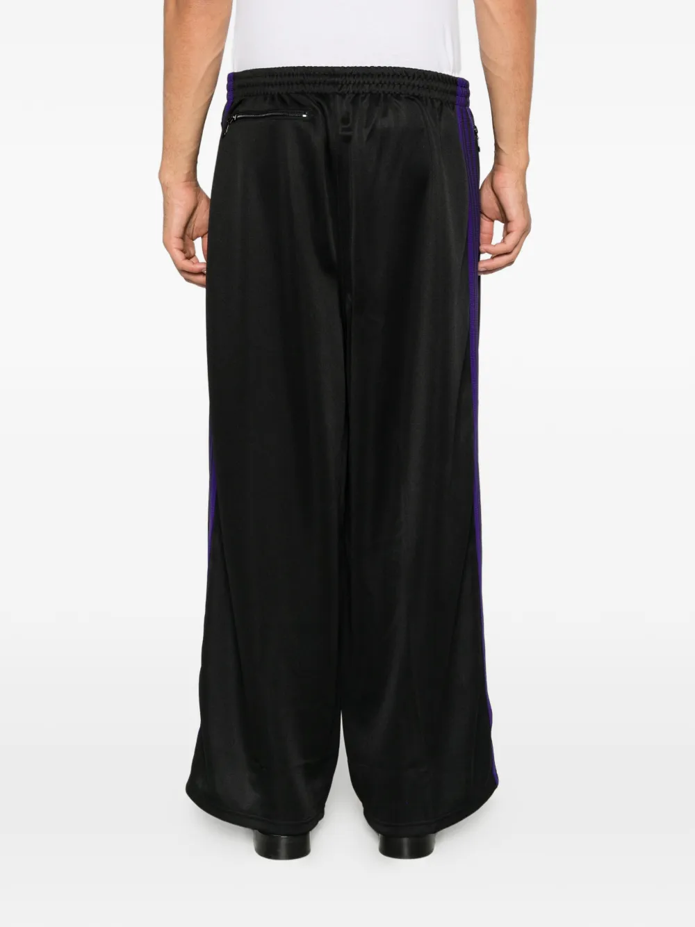 Needles side-stripe logo-embroidered track pants Zwart