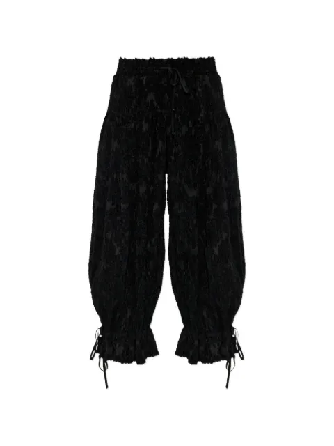 GANNI pantalones con pinzas y efecto deshilachado