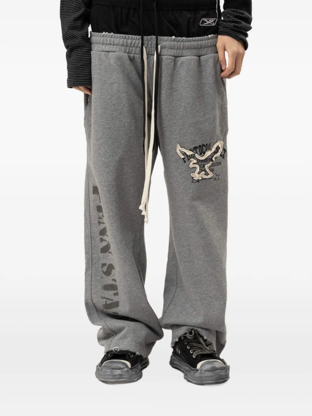 PROTOCOL INDEX layered eagle-patch track pants - Grigio
